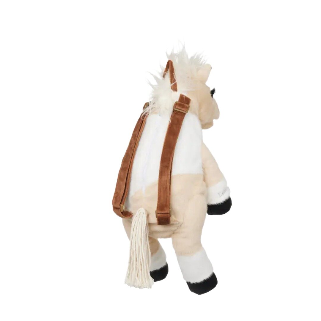 The back view of a fluffy palomino and white horse backpack with brown straps.